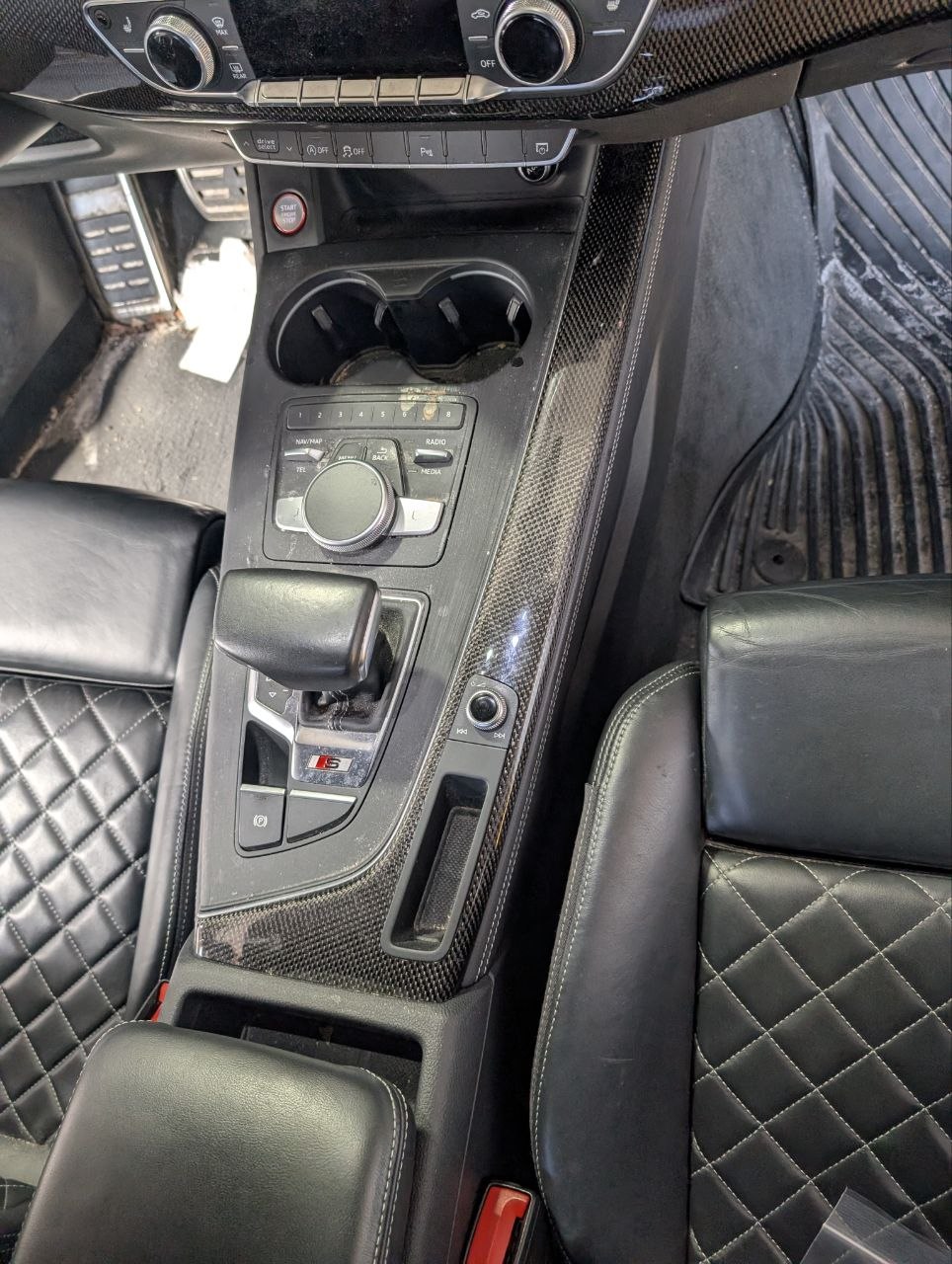Car interior before detailing — clutter and grime